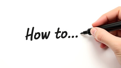 A close-up photo of a human hand holding a black marker, writing the phrase &ldquo;How to...&rdquo; on a clean white background.