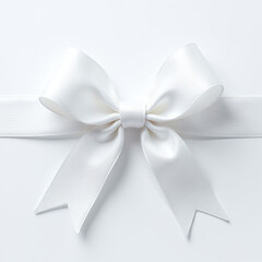 Naklejka premium Elegant white bow, ribbon fly form, soft satin fabric, isolated macro background with clipping