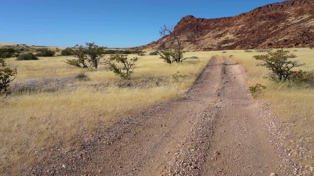 Panning on a gravel road to Doros Crater in Namibia, Africa.