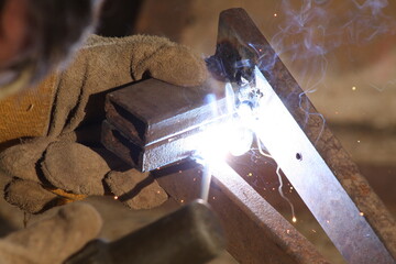 worker welding steel