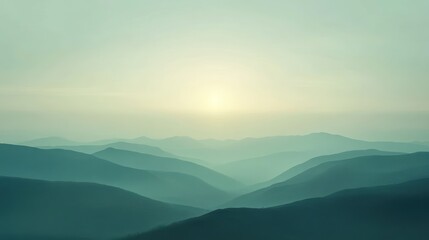 Obraz premium Serene sunrise over misty mountain range.