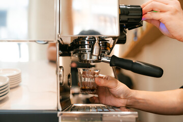 Barista Pulling Fresh Espresso Shot in Coffee Shop