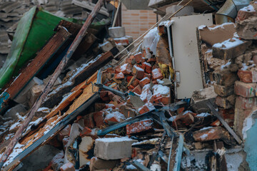 Civilian population. Consequences of shelling of a residential building in Ukraine. Destroyed roof,...