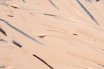 Foundation smoothly spread in layers across surface, showcasing texture variation