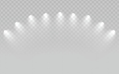 A set of bright white spotlights arranged in a semi-circular arc, shining downwards with a hazy or smoky effect, on a transparent light gray checkered background. Suitable for stage lighting, concerts