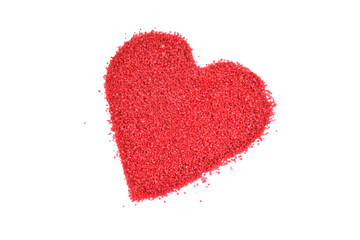 Red sand in heart shape isolated on white