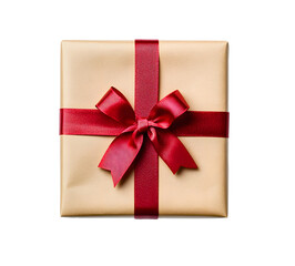 Top view of Christmas gift box wrapped in brown craft paper and red ribbon isolated on white or transparent background