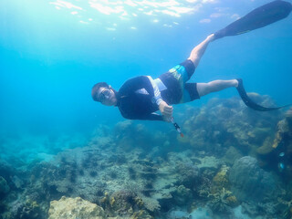 Freediver Swimming in Deep Sea DIver Eploring Sea Life.