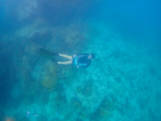 Freediver Swimming in Deep Sea DIver Eploring Sea Life.
