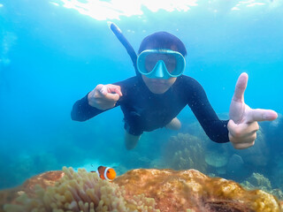 Freediver Swimming in Deep Sea DIver Eploring Sea Life.