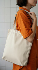 Sustainable Style: Woman with Beige Canvas Tote Bag in Orange Shirt ? Eco-Friendly Fashion, Everyday Essentials & Chic Minimalism