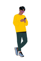 Stylish young man in a yellow sweatshirt standing full length using a smartphone. Modern digital vector illustration of a trendy guy browsing social media. Isolated on wtransparent background