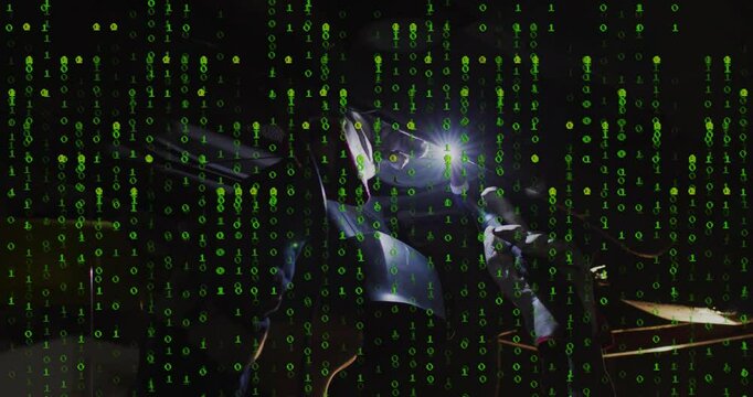 Green binary code animation over futuristic robotic machinery with glowing light