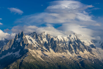 Obraz premium Chamonix Montblanc beautiful alpine mountain summits landscape. Alps mountains with snow and glacier above green valley of Chamonix in France. Alps beautiful scenery in summer
