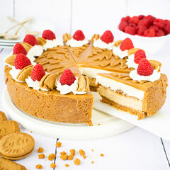 No-Bake Lotus Biscoff Cheesecake with Whipped Cream and Raspberries.