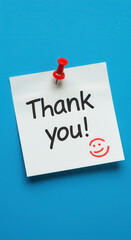 Thank You Note! A Cheerful & Bright Reminder of Gratitude. Appreciation Message on Sticky Note. Positive Affirmation on Blue Background.