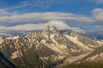 Chamonix Montblanc beautiful alpine mountain summits landscape. Alps mountains with snow and glacier above green valley of Chamonix in France. Alps beautiful scenery in summer