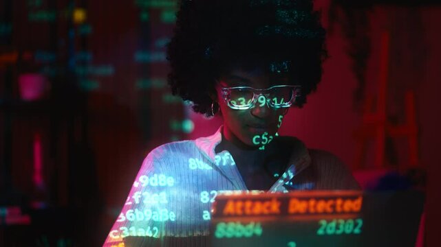 Young woman hacking security system, ddos attack detected, spyware alert