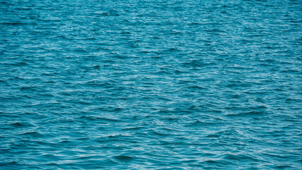 pattern of blue sea water with small waves