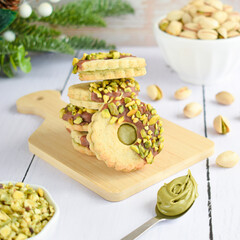 Crunchy Pistachio Sandwich Cookies with Chocolate Drizzle.