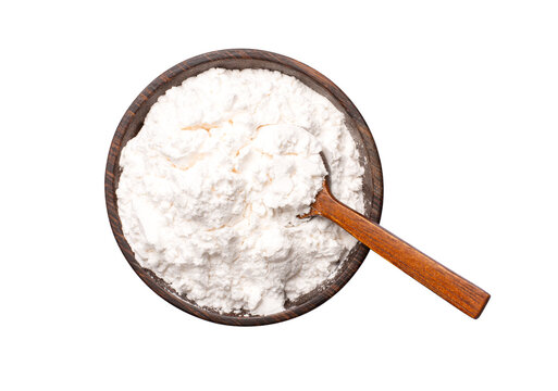 Tapioca starch (potato flour or powder) in wooden bowl with spoon isolated 