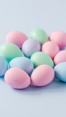 Fototapeta premium Colorful pastel eggs arranged on a light background for spring celebrations and festive decoration