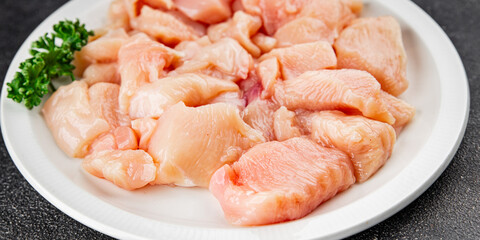 Chicken raw meat pieces of meat poultry tasty fresh delicious gourmet food background on table rustic food top view copy space keto and paleo diet