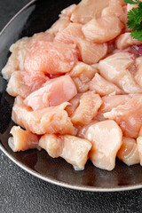 Chicken raw meat pieces of meat poultry tasty fresh delicious gourmet food background on table rustic food top view copy space keto and paleo diet