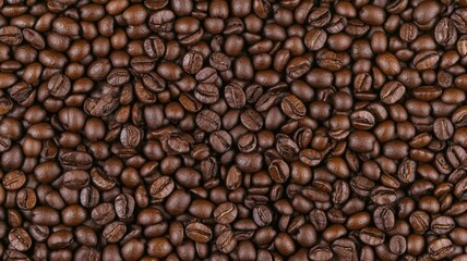 Fototapeta premium Roasted Coffee Beans Full Frame with Rich Brown Texture Perfect for Food and Beverage Backgrounds and Still Life Photography in Studio Lighting