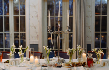 Elegant Dining Table Set for a Special Occasion with Flowers and Candles