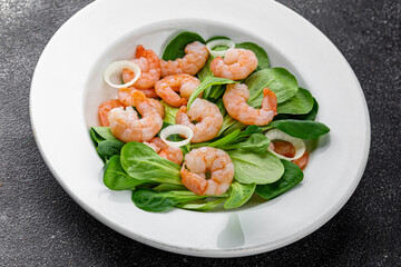 Shrimp salad prawns seafood dish fresh gourmet food background on table rustic food top view copy space