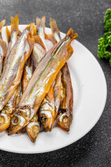Smoked fish capelin sprat fresh dish gourmet food background on table rustic food top view copy space  