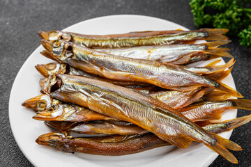 Smoked fish capelin sprat fresh dish gourmet food background on table rustic food top view copy space  