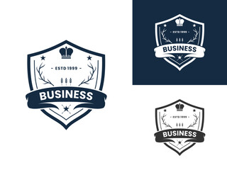 Obraz premium Retro Shield with Crown and Dry Branches logo design vector template. Shield Vintage old style logo design icon