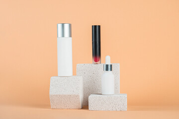 Plastic white tube for cream or lotion. Skin care or sunscreen cosmetic with stylish props on cream background.