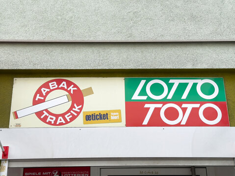 Tobacco and lottery shop signage with tabak trafik and lotto toto logos