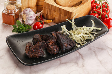 Grilled beef barbecue served onion