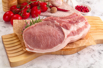 Raw potk loin steak with bone