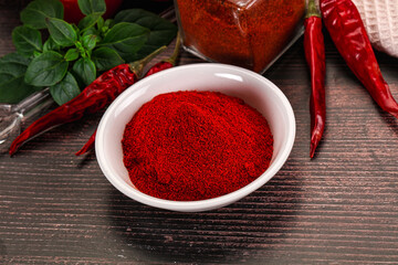 Spicy dry paprika powder in the bowl