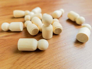 A true leader rises to guide the way. One of the wooden peg are standing to guide the others. leadership concept.