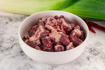 Raw chicken hearts in the bowl