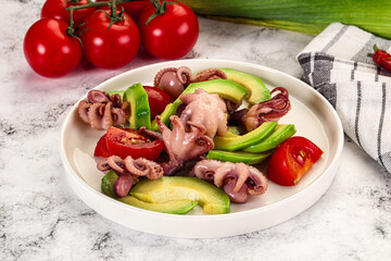 Salad with baby octopus and avocado