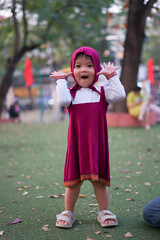 little girl playing in the park
