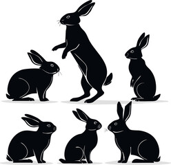 Obraz premium Rabbit silhouettes: Artistic representation of dynamic rabbits, elegantly illustrated in sleek black, showcasing the grace and agility of the animal in a creative depiction.