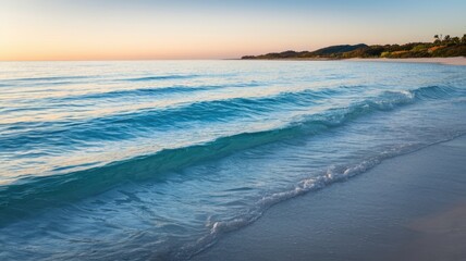 Obraz premium Serene Sunset Beach Ocean Waves Gently Crashing on White Sand Shore
