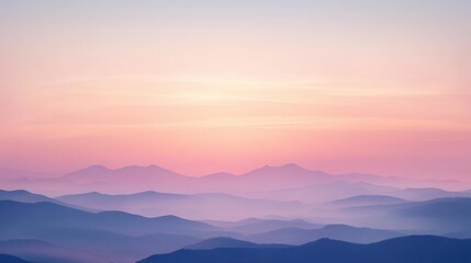 Obraz premium A serene vista of pastel-toned mountains at sunrise.