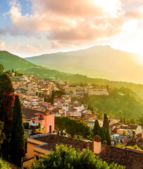 View at town Taormina, old touristic place in Sicily, Italy. Taormina town coastal view. Sunny old italian town, Mediterranean Coast in Europe