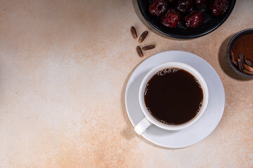 Healthy organic date seed coffee, black coffee cup, made with grated date seeds, with whole date...