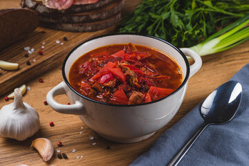 Borscht in a plate on the table