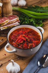 Borscht in a plate on the table